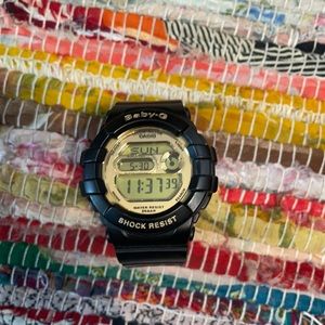 Black and gold G-shock watch